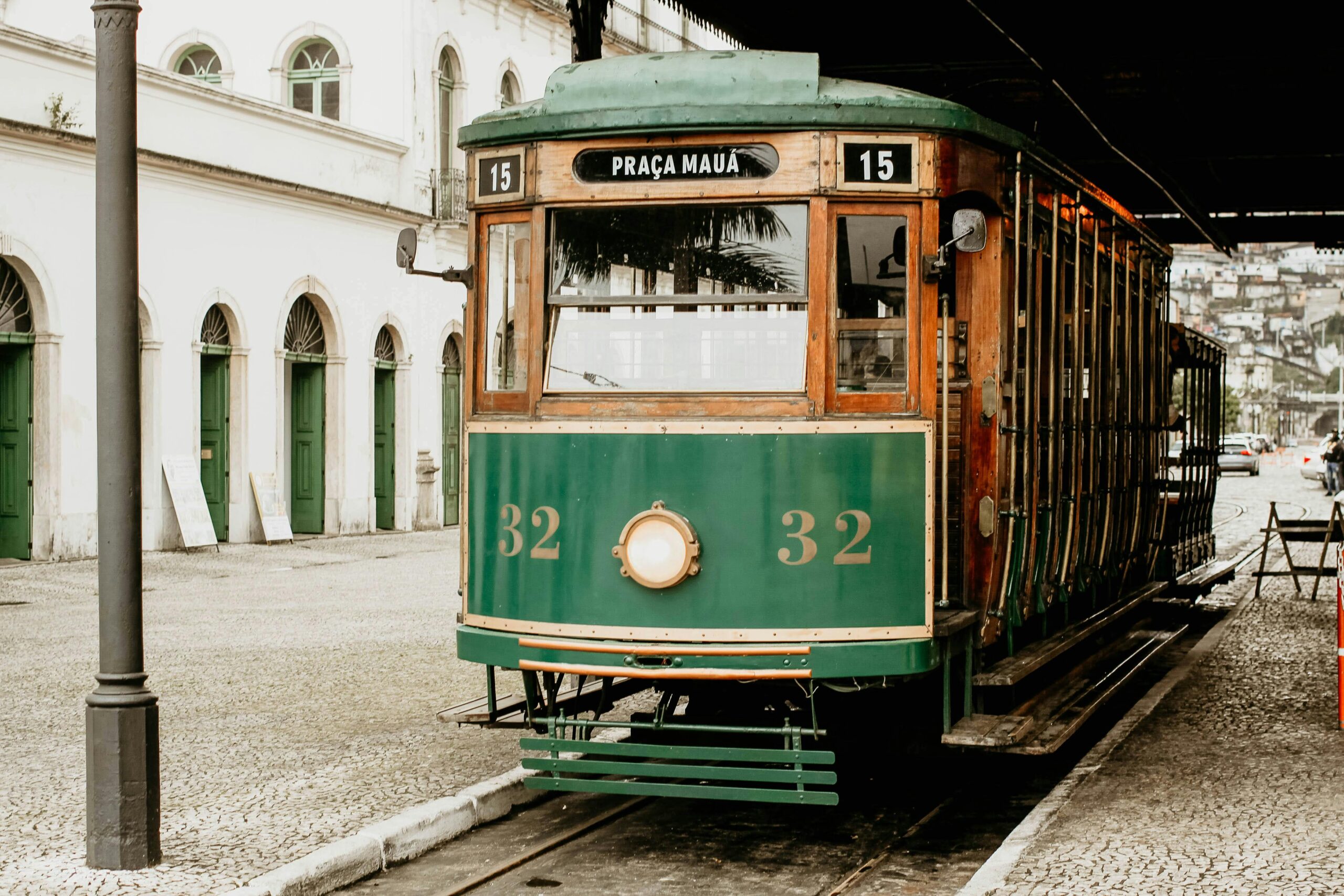 A vintage tram from Praça Mauá in Santos, Brazil, showcasing retro urban charm against a historic architecture backdrop.